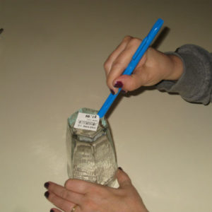 Scraping label of glass