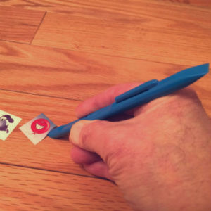 scraping sticker off wood floor